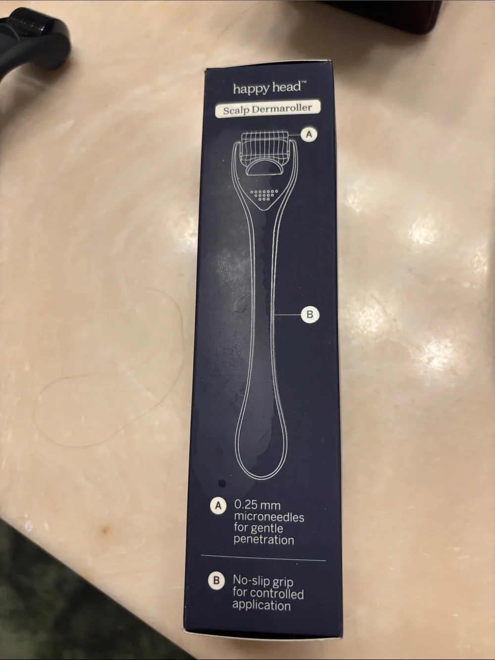 Happy Head scalp dermaroller. New in original box. Comes with case.